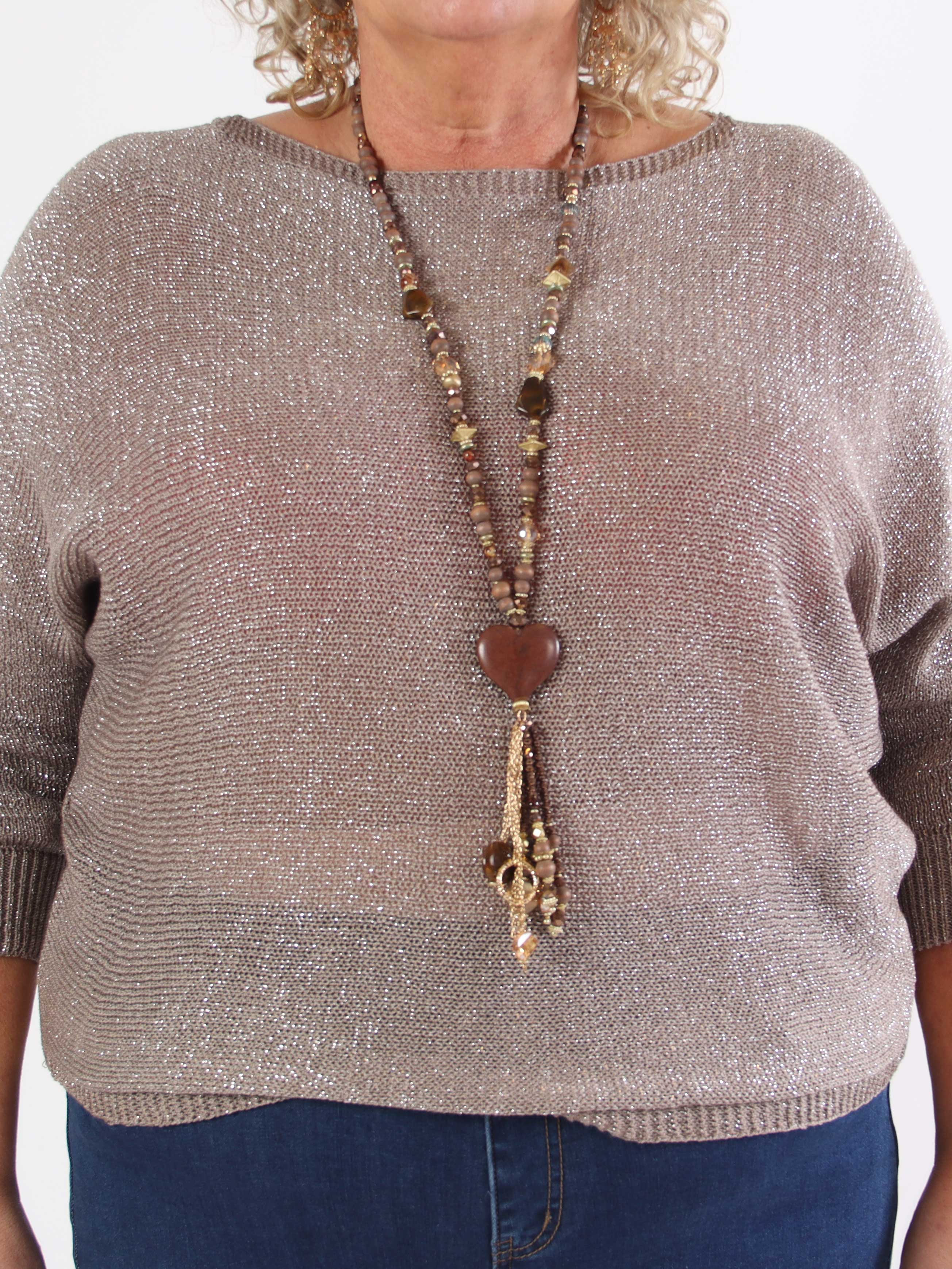 Paulina - Stickad blus i plus size med glittertrådar och rosett